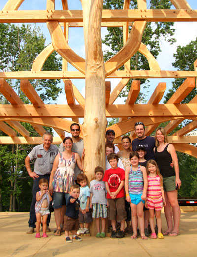 The newly raised timber frame and the extended family